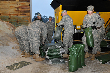 Massachusetts National Guardsmen fill sand bags Oct. 28, 2012, in preparation for Hurricane Sandy at the Massachusetts Department of Transportation facility.